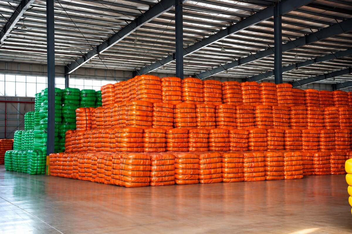 Warehouse stock of packed polyester fiber bales